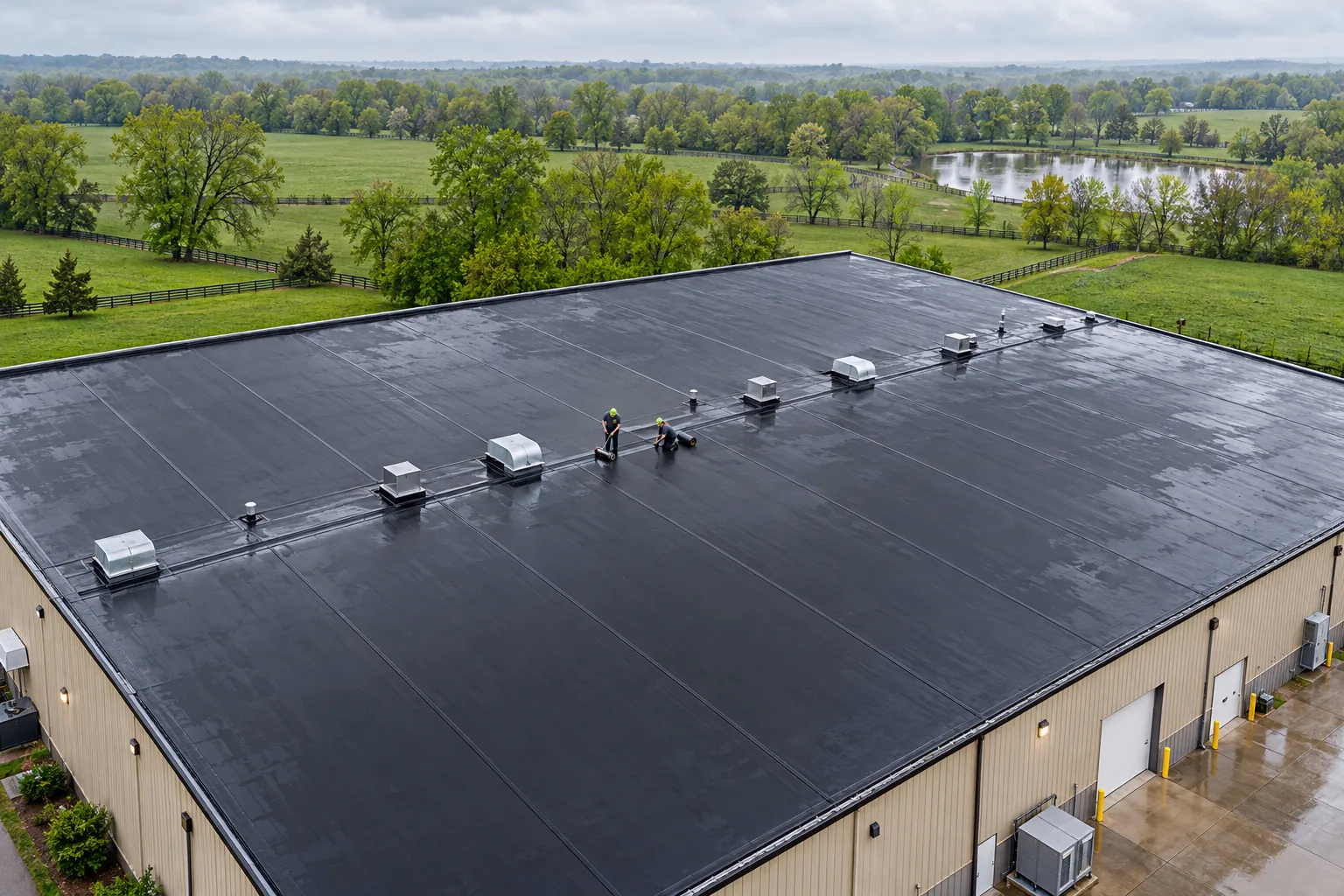 Crew working on an EPDM rubber membrane commercial roof